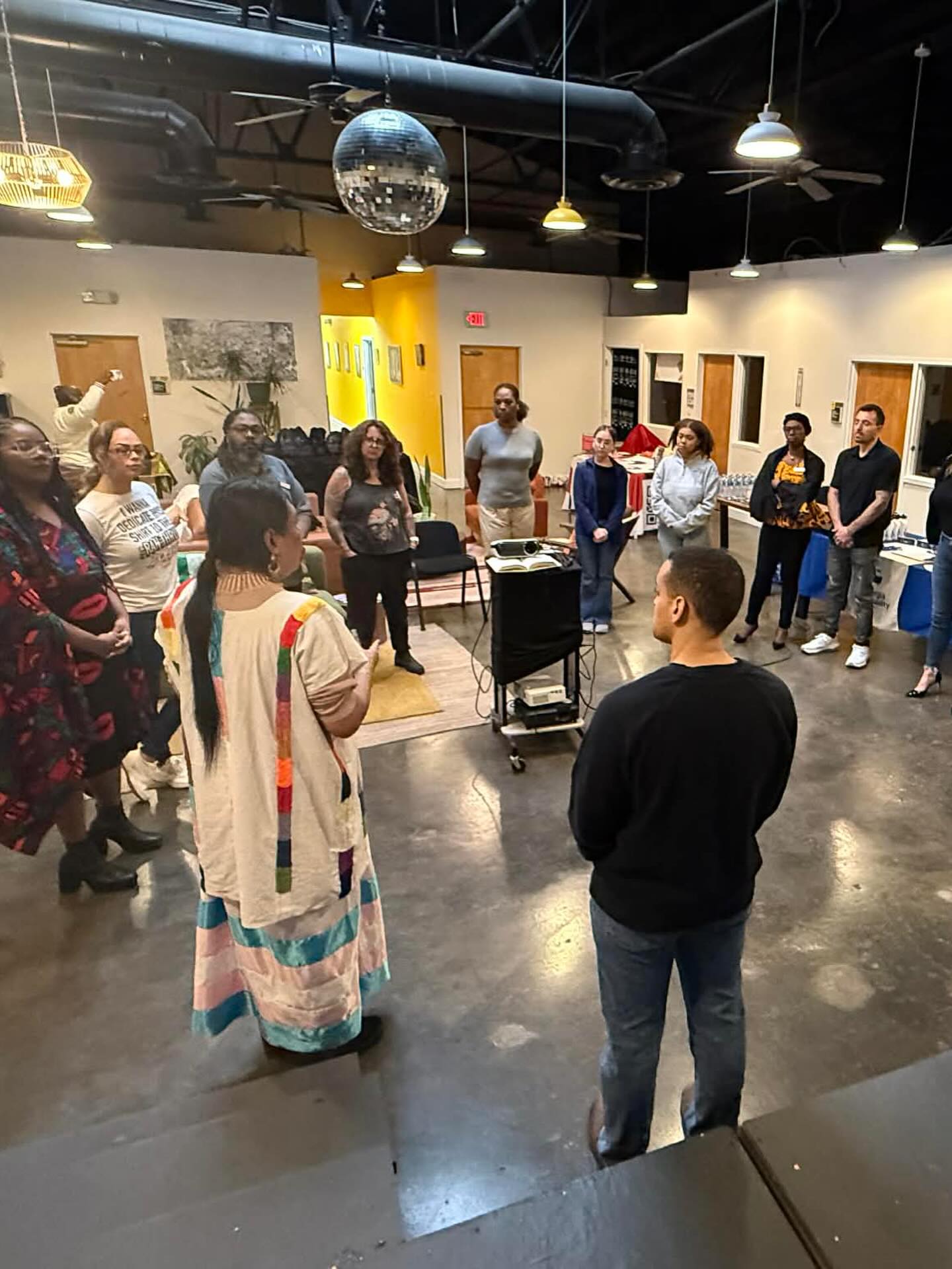 Community members gathered in a circle for shared learning and reflection