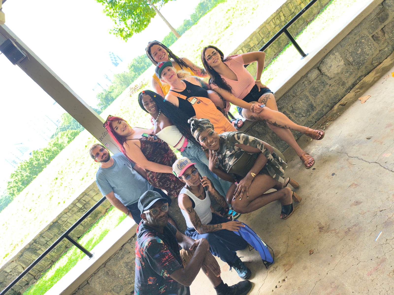 Dreaming Justice outreach team sharing food, harm reduction, and wellness supplies in Piedmont Park